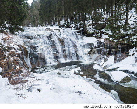 Mumlavsky vodopad, waterfall on Mumlava river stream in Krkonose National Park, Czech Republic in winter snow covered forest 93851927