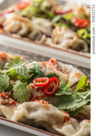 Japanese dumplings Gyoza stuffed chicken meat or vegetable with chili and herbs 93852755
