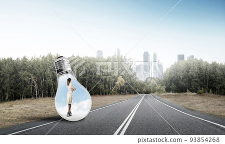 Businesswoman inside light bulb 93854268