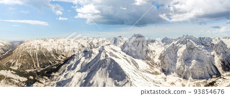 Clouds over mountains in winter  93854676