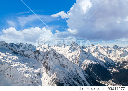 Fluffy cloud over mountains in winter  93854677