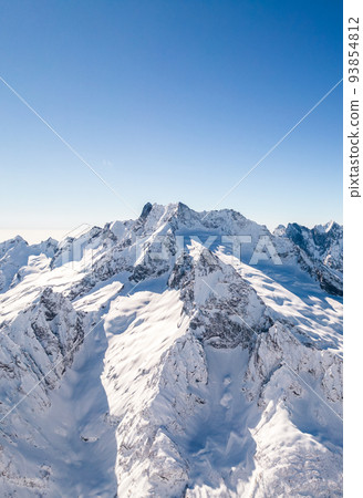 rocky mountains in snow and clear sky  93854812