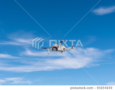 Drone flying against the sky . Drone flying against the sky . 93854839