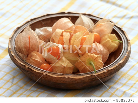 Ripe fruits of Physalis peruviana on the cloth 93855375
