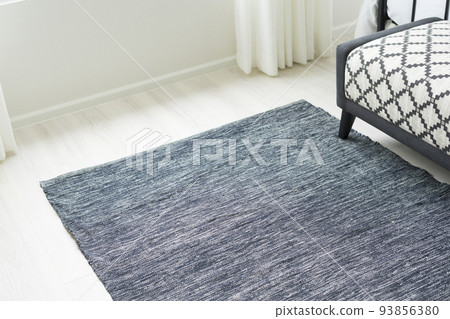 Grey carpet on floor in bedroom with bench. 93856380