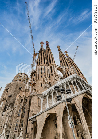 Spain Barcelona Sagrada Familia shining in the blue sky 93858219