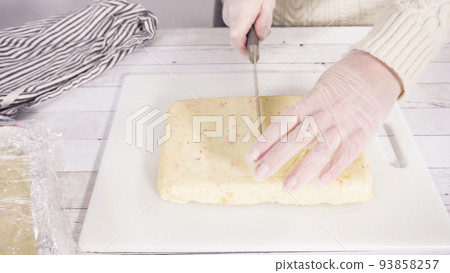 Step by step. Cutting homemade candy cane fudge on a white cutting board. Step by step. Cutting homemade candy cane fudge on a white cutting board. 93858257
