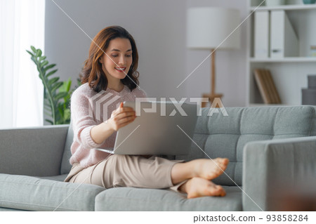 woman using laptop woman using laptop 93858284
