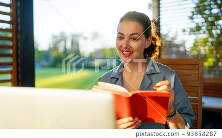 woman is working sitting on the patio woman is working sitting on the patio 93858287