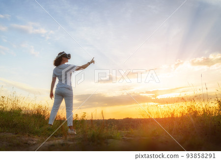 Woman with VR virtual reality goggles Woman with VR virtual reality goggles 93858291