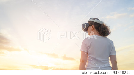 Woman with VR virtual reality goggles Woman with VR virtual reality goggles 93858293