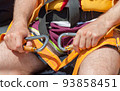Man prepared carbines for fastening to the safety rope. 93858451