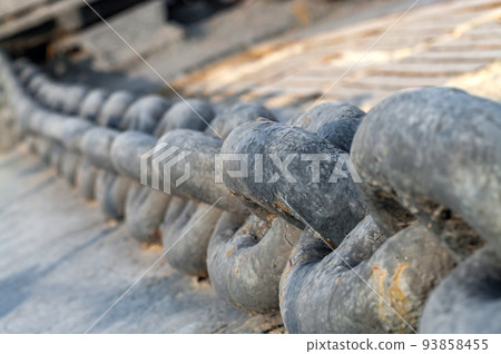 Anchor chain on ship deck. Close-up. Selective focus. Anchor chain on ship deck. Close-up. Selective focus. 93858455