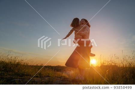Happy family at sunset 93858499
