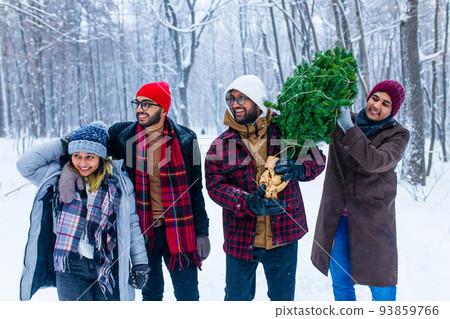 Outdoor lifestyle portrait of four best friends carrying the tree to home 93859766