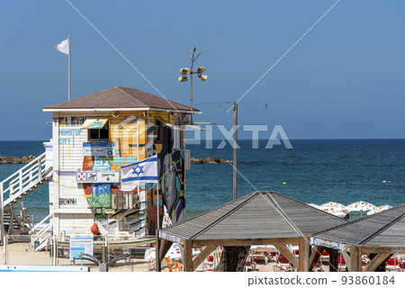 Lifeguard booth stands at the shore line on the beach 93860184