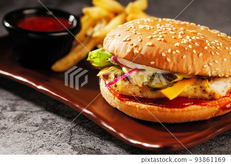 Burger. Juicy pork cutlet, cheddar cheese, crispy pickled onions, lettuce wrapped in a bun under two sauces. Served with french fries and cream sauce. Burger. Juicy pork cutlet, cheddar cheese, crispy pickled onions, lettuce wrapped in a bun under two sauces. Served with french fries and cream sauce. 93861169