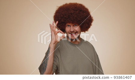 Man looking approvingly, showing ok approve feedback gesture like sign positive something good 93861407