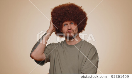 Thoughtful clever man looking aside with pensive expression, pondering a solution, doubting question 93861409