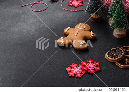 Delicious gingerbread cookies with honey, ginger and cinnamon. Winter composition Delicious gingerbread cookies with honey, ginger and cinnamon. Winter composition 93861461