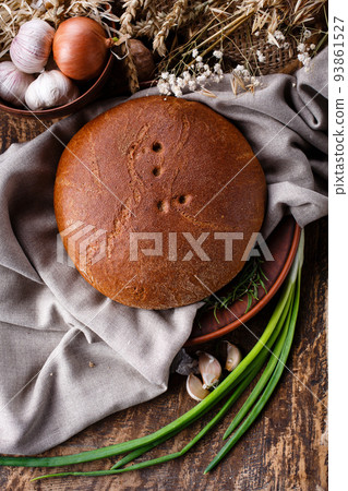 Close up of rye bread on rustic background. Homemade bread. Close up of rye bread on rustic background. Homemade bread. 93861527