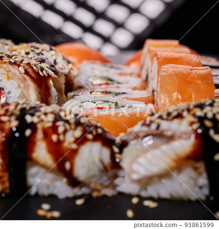 Philadelphia with cream cheese, salmon, cucumber and caviar lies among juicy nigiri sushi. Philadelphia with cream cheese, salmon, cucumber and caviar lies among juicy nigiri sushi. 93861599