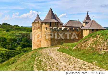 Old medieval fortress castle museum on green hills by the river Old medieval fortress castle museum on green hills by the river 93863463