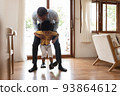 African Father playing with his boy 93864612