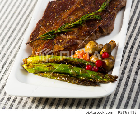 Prepared steak entrecote of beef with mushroom and asparagus Prepared steak entrecote of beef with mushroom and asparagus 93865485