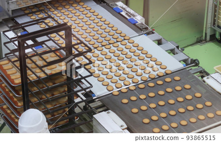 A person working at a food factory A person working at a food factory 93865515