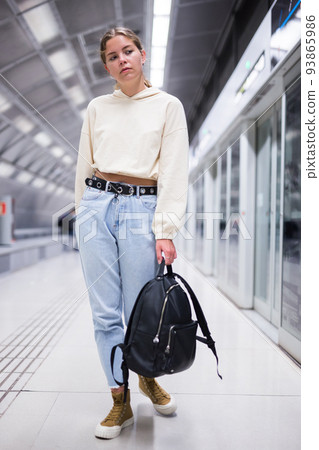 Portrait of a girl in the subway, walking on the platform Portrait of a girl in the subway, walking on the platform 93865986