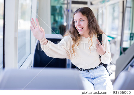 Portrait of a positive girl riding on public transport 93866000