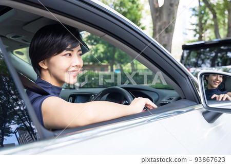 A woman driving a car A woman driving a car 93867623