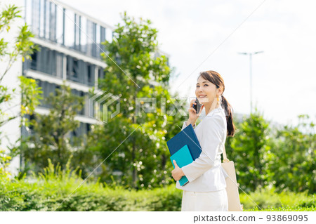 A woman talking on a smartphone A woman talking on a smartphone 93869095