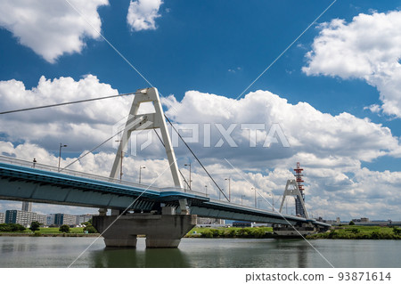 Cotton clouds floating above Toyosato Bridge and Yodo River 93871614