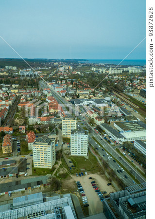 Aerial view from above Drone public transport scene in Gdansk. Oliva star business district Transport city traffic. Trams buses cars City Traffic Jam Aerial view from above Drone public transport scene in Gdansk. Oliva star business district Transport city traffic. Trams buses cars City Traffic Jam 93872628