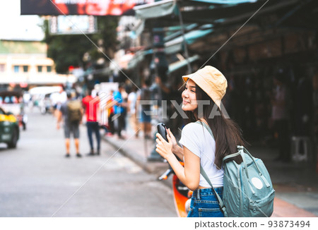 Young asian traveler happy woman in white shirt with backpack. 93873494
