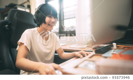 Young adult asian woman stay at home using computer for internet online. 93873946