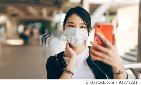 Selfie young adult business asian working woman wear face mask for protect virus corona or covid19. 93875221