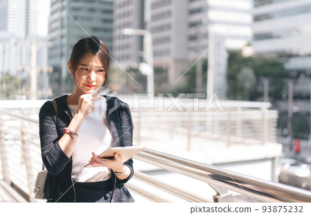 Young adult business working asian woman using digital tablet for corporate with team via online. Young adult business working asian woman using digital tablet for corporate with team via online. 93875232