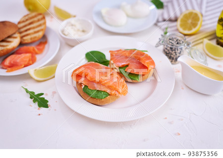 Breakfast Ingredients - Smoked salmon, poached egg and grilled buns Breakfast Ingredients - Smoked salmon, poached egg and grilled buns 93875356