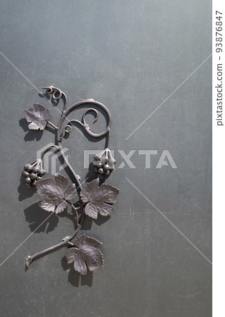 wrought-iron grille showing the vines in Eger, Hungary 93876847
