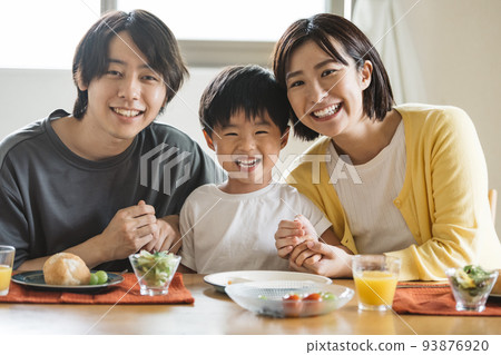 Family dining table, smiling family image 93876920