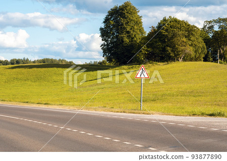 Country road and pedestrians in road sign Country road and pedestrians in road sign 93877890