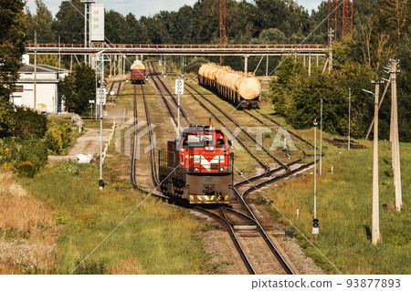 Lone shunting locomotive in red color at marshalling yard Lone shunting locomotive in red color at marshalling yard 93877893