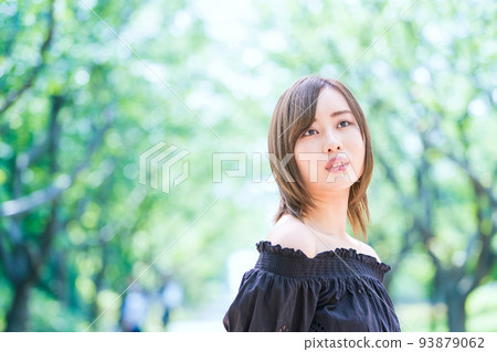 woman portrait in green space woman portrait in green space 93879062