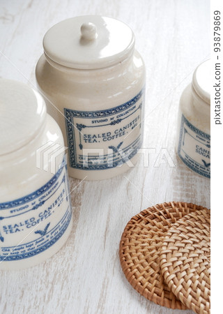 Antique canister and coaster [kitchen image] 93879869