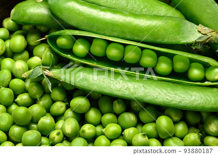green peas in detail as a background, the concept of fresh vegetables and healthy food 93880187