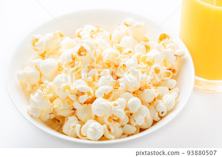 popcorn and orange juice. 93880507