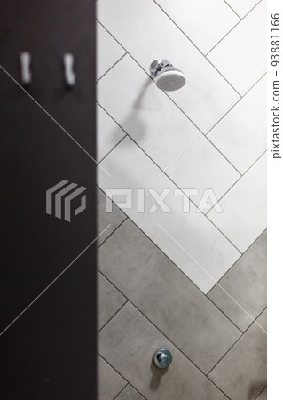 Stylish minimalist shower head built into wall in modern bathroom. Stylish minimalist shower head built into wall in modern bathroom. 93881166